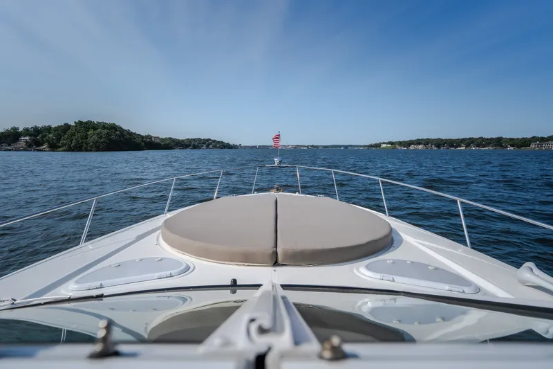 Slide: The Image of 2012 Cruisers Yachts 380 Express on open water, clear sky, scenic view. - 57