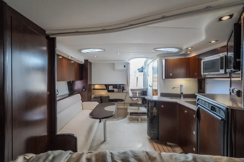 Slide: The Image of Luxurious interior of 2012 Cruisers Yachts 380 Express with modern kitchen and seating area. - 53