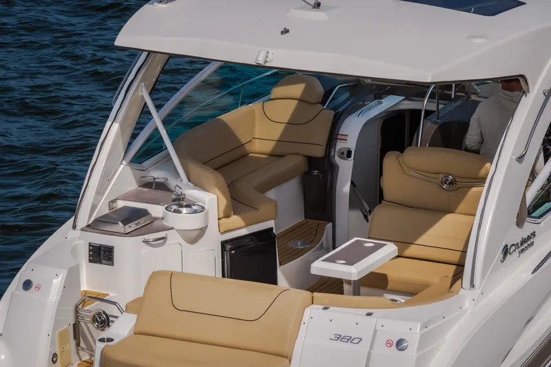 Slide: The Image of 2012 Cruisers Yachts 380 Express with luxurious seating and sleek design on the water. - 10