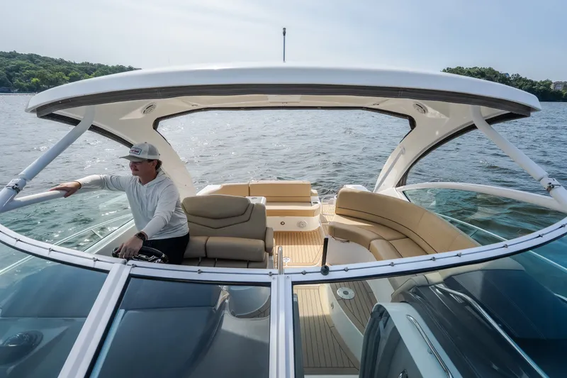 Slide: The Image of 2012 Cruisers Yachts 380 Express on water, featuring spacious seating and modern design. - 66