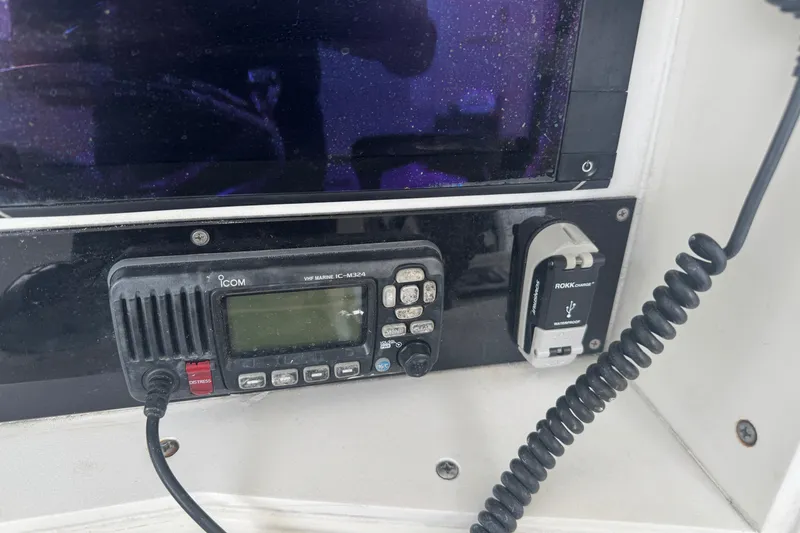 Slide: The Image of VHF marine radio and USB charger on 1997 Venture 34 Center Console boat. - 26