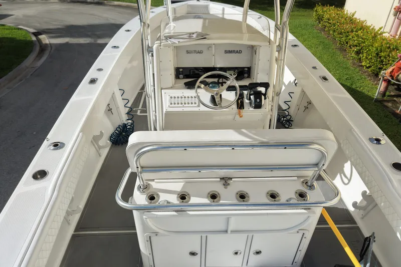 Slide: The Image of 1997 Venture 34 Center Console boat interior with steering wheel and seating. - 37