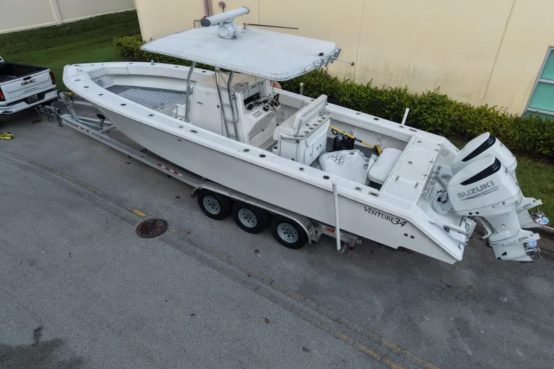 Slide: The Image of 1997 Venture 34 Center Console boat on trailer with Suzuki outboard engines. - 5