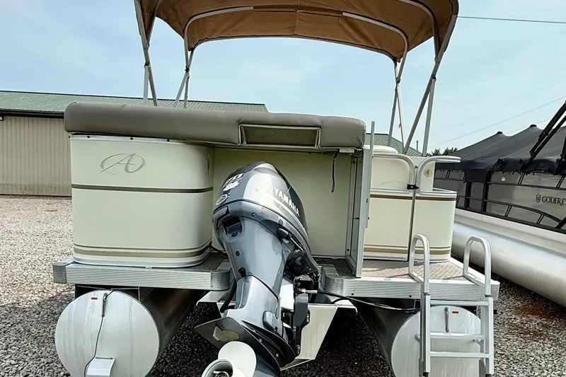 Slide: The Image of 2005 Avalon Paradise Elite 2425 pontoon boat with Yamaha outboard motor and canopy. - 5