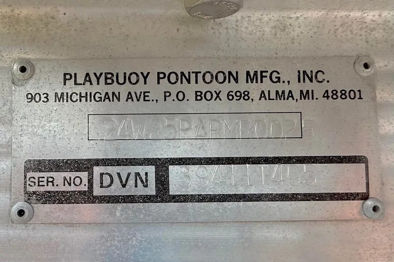 Slide: The Image of Playbuoy Pontoon Manufacturing label with serial number for Avalon Paradise Elite 2425, 2005 model. - 13