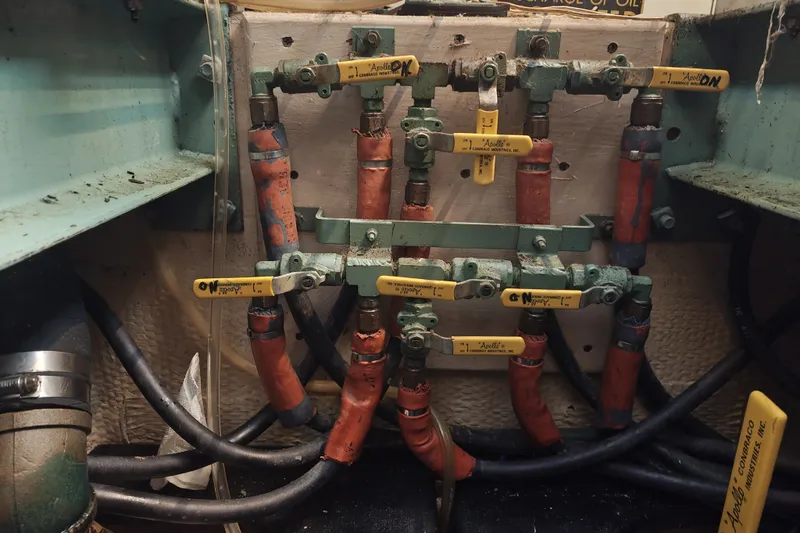 Slide: The Image of A complex system of valves and hoses in a boat's engine room. - 27