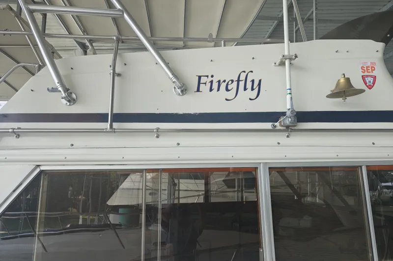 Slide: The Image of The image shows a boat named "Firefly" with a bell on the side. - 4