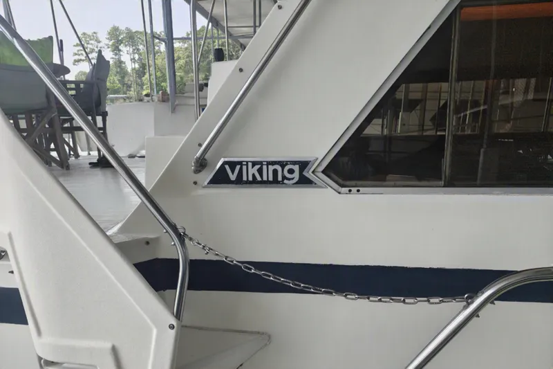 Slide: The Image of Close-up of a white boat with "Viking" logo and blue trim. - 7