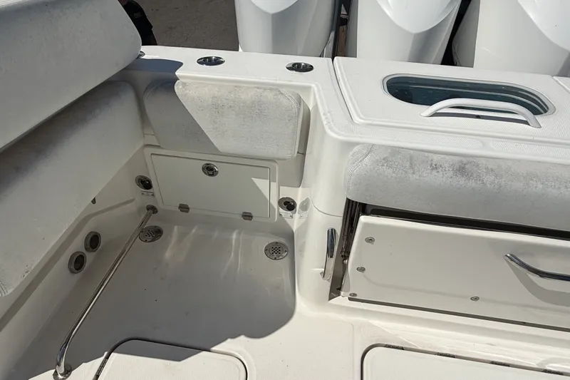 Slide: The Image of Interior view of a 2019 HCB 42 Siesta boat, featuring seating and storage compartments. - 5
