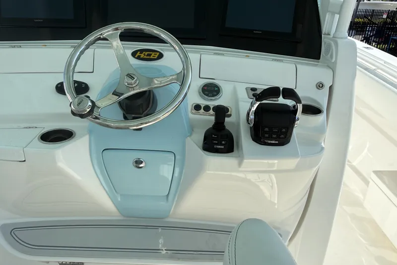 Slide: The Image of Helm of 2019 HCB 42 Siesta boat with steering wheel and controls. - 20
