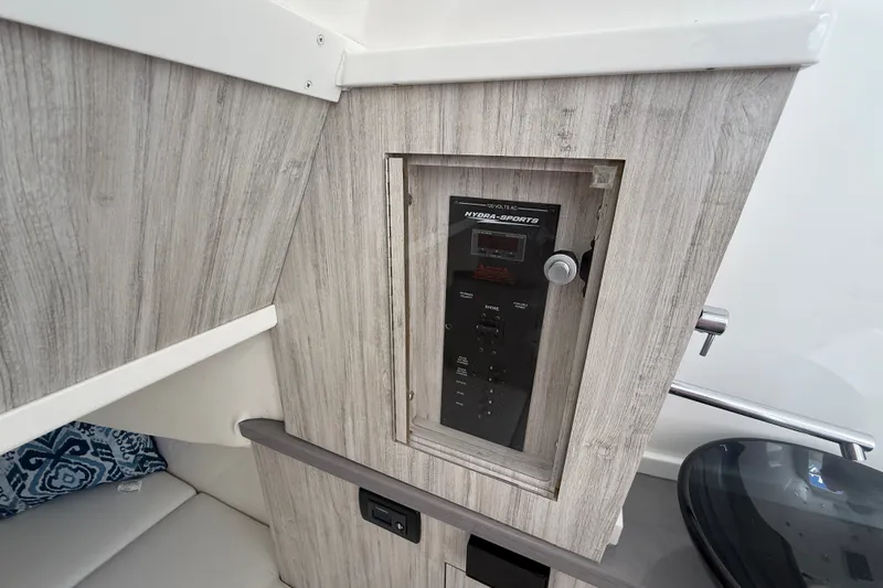 Slide: The Image of Control panel inside 2019 HCB 42 Siesta boat with wood finish and modern design. - 37