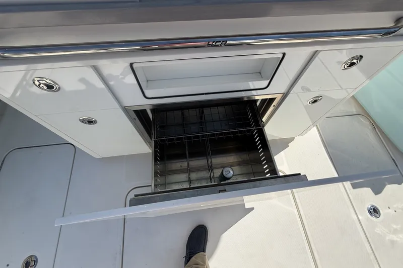 Slide: The Image of Open storage compartment on 2019 HCB 42 Siesta boat, showcasing sleek design and functionality. - 8