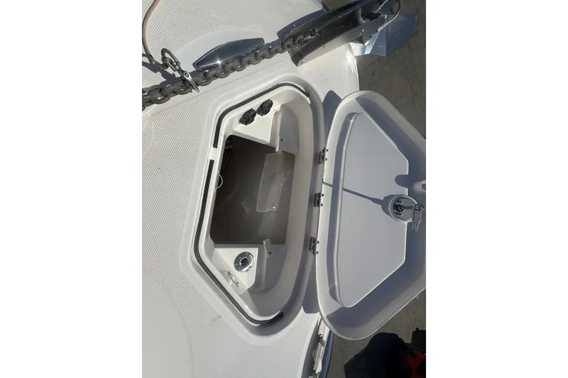 Slide: The Image of Open storage compartment on 2019 HCB 42 Siesta boat deck. - 28