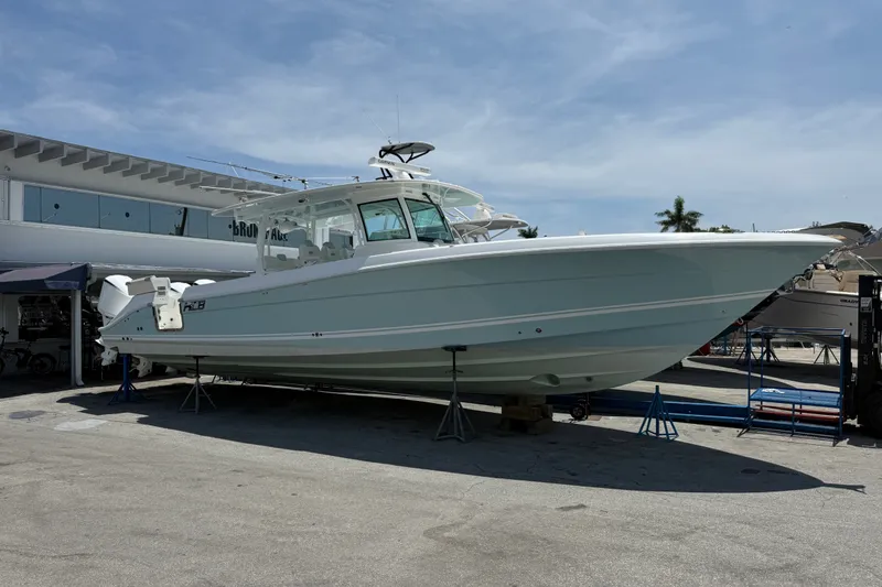 The Image of 2019 HCB 42 Siesta boat on display at a marina under a clear blue sky. - 0