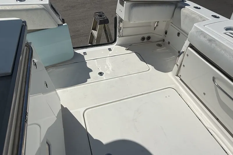 Slide: The Image of 2019 HCB 42 Siesta boat deck, featuring spacious seating and storage areas. - 2
