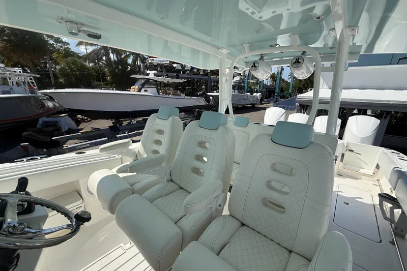 Slide: The Image of 2019 HCB 42 Siesta boat interior with luxurious seating and modern helm. - 22