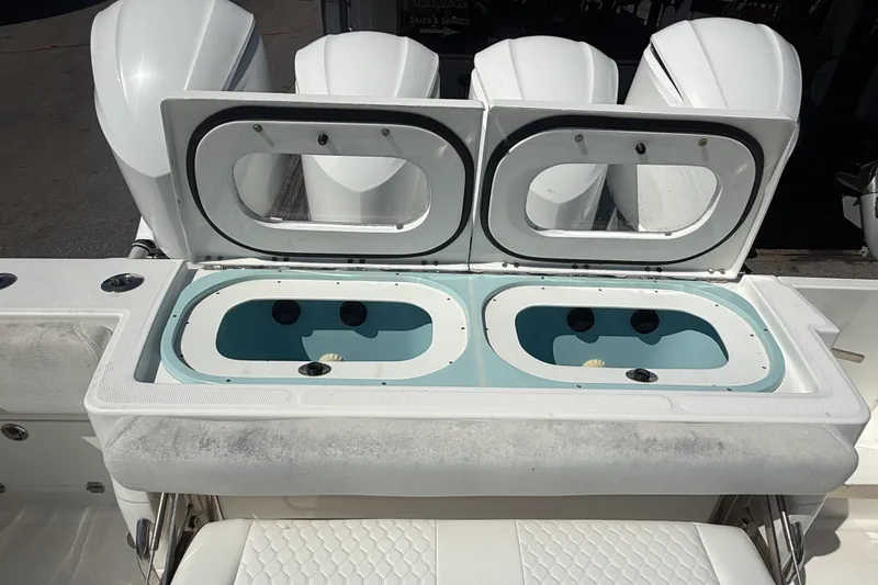 Slide: The Image of 2019 HCB 42 Siesta boat with dual livewells and powerful outboard engines. - 6