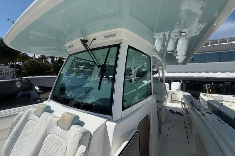 Slide: The Image of 2019 HCB 42 Siesta boat interior with seating and helm station. - 33