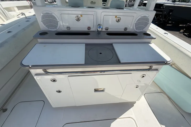 Slide: The Image of 2019 HCB 42 Siesta boat interior with cutting boards and storage compartments. - 9