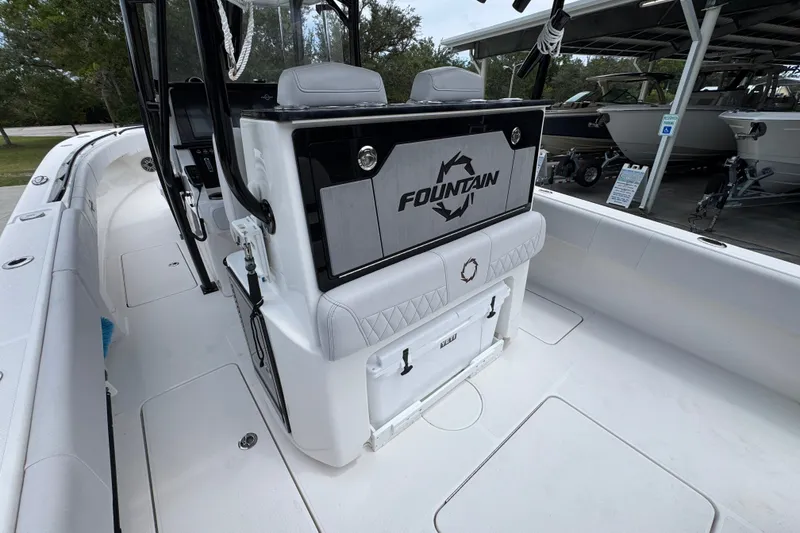 Slide: The Image of 2024 Fountain 34 Tournament Edition boat interior, featuring sleek seating and storage compartments. - 39