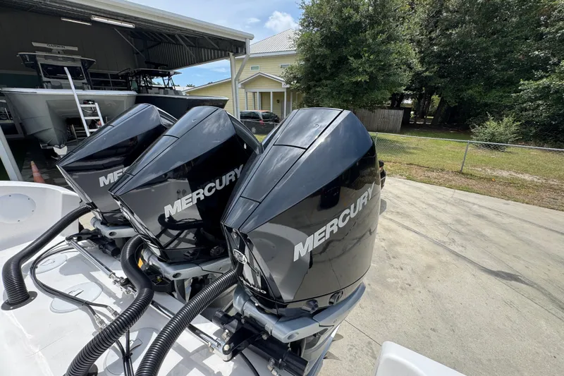 Slide: The Image of Triple Mercury outboard engines on a 2024 Fountain 34 Tournament Edition boat. - 46