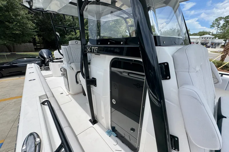 Slide: The Image of 2024 Fountain 34 Tournament Edition boat interior with seating and console. - 29