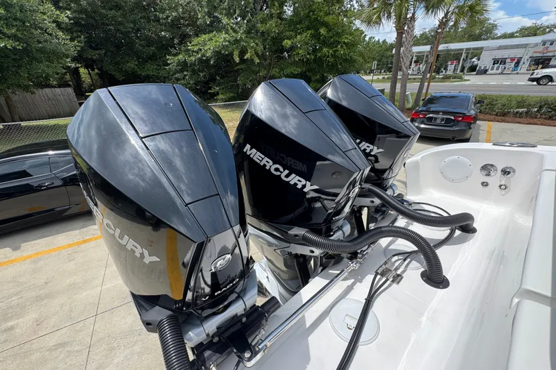Slide: The Image of Triple Mercury outboard engines on a 2024 Fountain 34 Tournament Edition boat. - 47