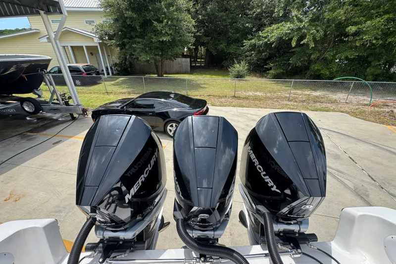 Slide: The Image of Triple Mercury outboard engines on a 2024 Fountain 34 Tournament Edition boat. - 45