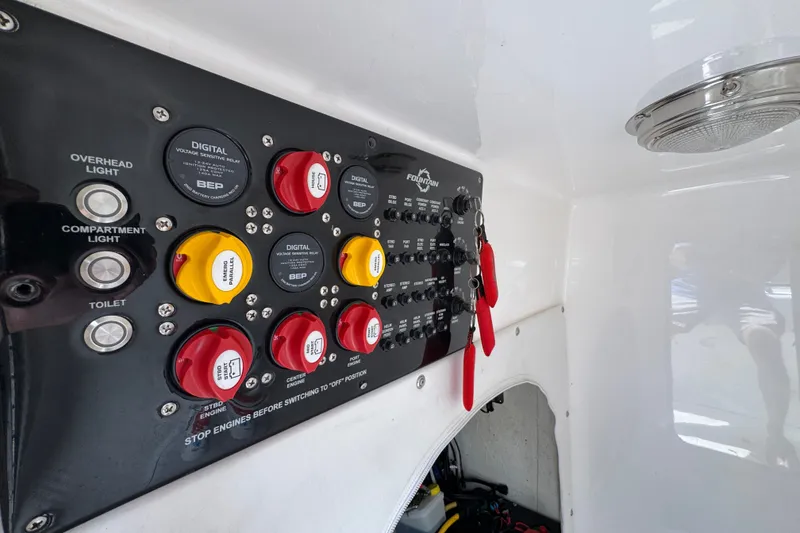 Slide: The Image of Control panel of 2024 Fountain 34 Tournament Edition boat with switches and indicators. - 31