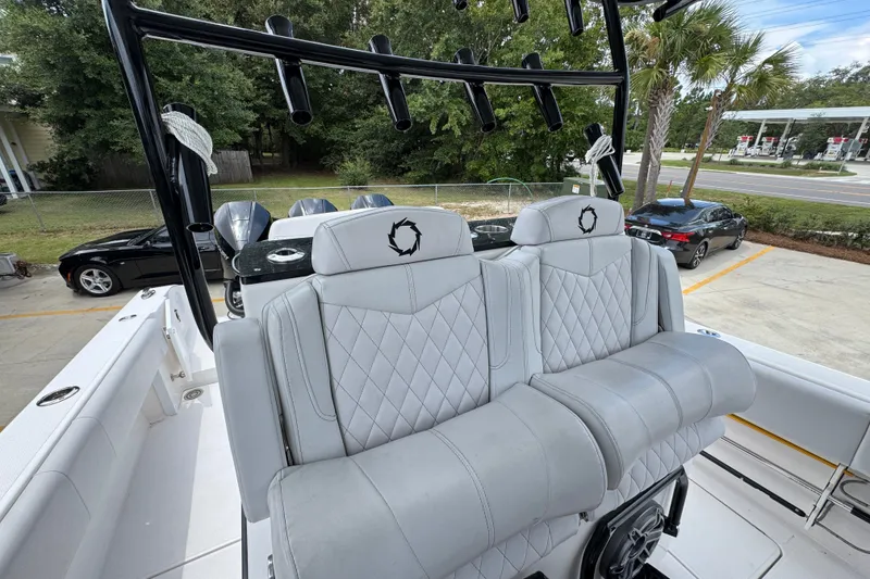 Slide: The Image of 2024 Fountain 34 Tournament Edition boat with luxurious seating and rod holders. - 35