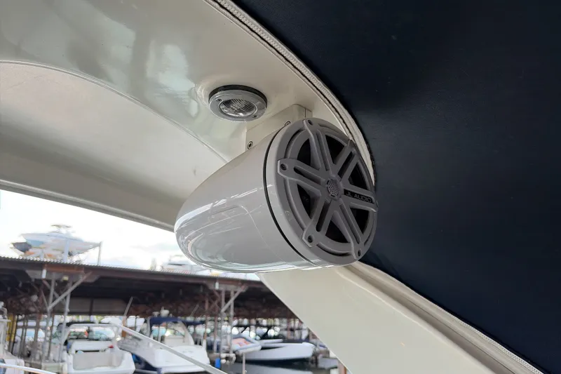 Slide: The Image of Speaker system on a 2007 Sea Ray 290 Sundancer boat, docked at a marina. - 35