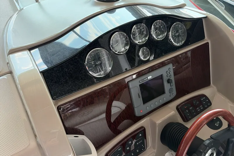 Slide: The Image of Dashboard of a 2007 Sea Ray 290 Sundancer boat with gauges and controls. - 20