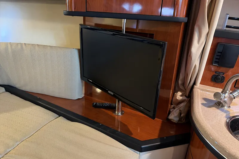 Slide: The Image of Interior of 2007 Sea Ray 290 Sundancer with TV and seating area. - 25