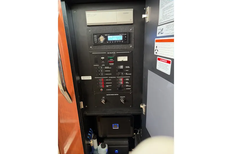 Slide: The Image of Control panel of a 2007 Sea Ray 290 Sundancer boat with various switches and labels. - 31