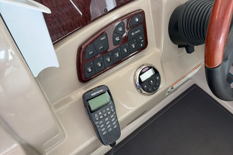 Slide: The Image of Control panel of a 2007 Sea Ray 290 Sundancer boat with navigation equipment. - 22