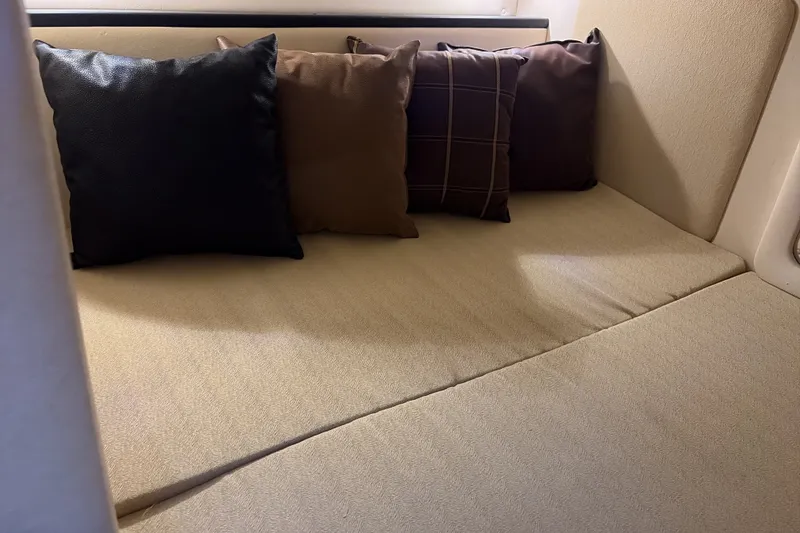 Slide: The Image of Interior cabin of 2007 Sea Ray 290 Sundancer with cozy cushions. - 29