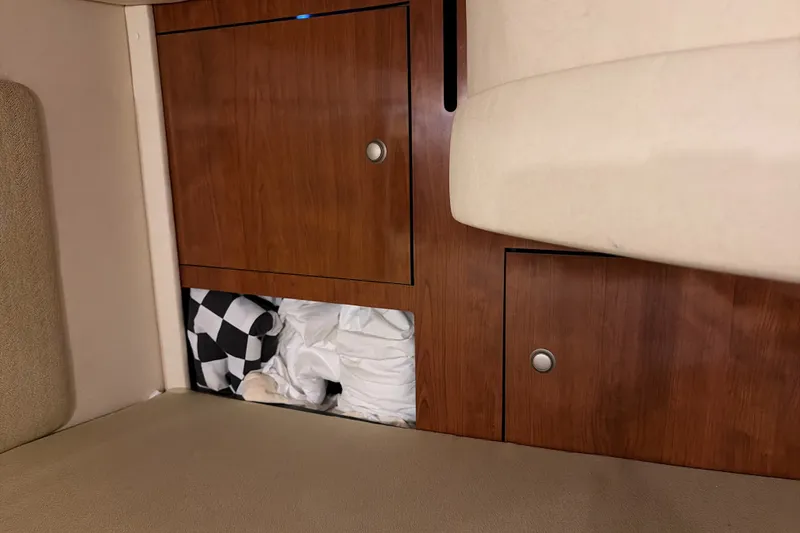 Slide: The Image of Interior storage compartment on a 2007 Sea Ray 290 Sundancer boat. - 30