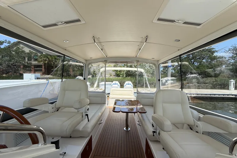 Slide: The Image of Interior of 2018 MJM 35z yacht with luxurious seating and wooden flooring. - 18