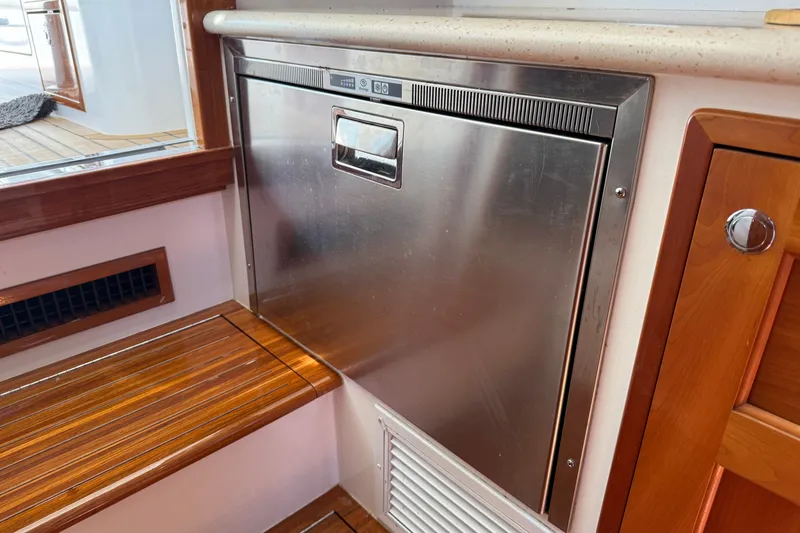 Slide: The Image of Stainless steel appliance on 2018 MJM 35z yacht with wooden interior accents. - 32