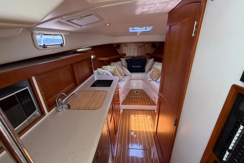 Slide: The Image of Luxurious interior of 2018 MJM 35z yacht with elegant wood finishes and cozy seating area. - 23