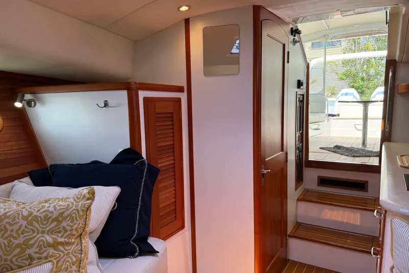 Slide: The Image of Interior of 2018 MJM 35z yacht with cozy seating and wooden accents. - 29