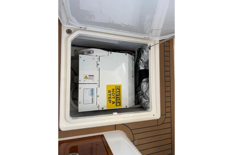 Slide: The Image of Engine compartment of a 2018 MJM 35z boat with caution label. - 38