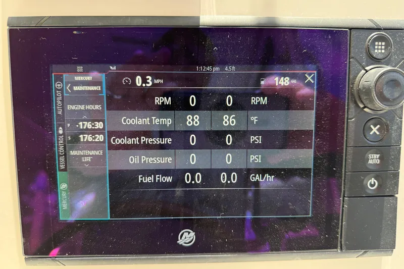 Slide: The Image of Boat control panel displaying engine metrics for MJM 35z, 2018 model. - 22