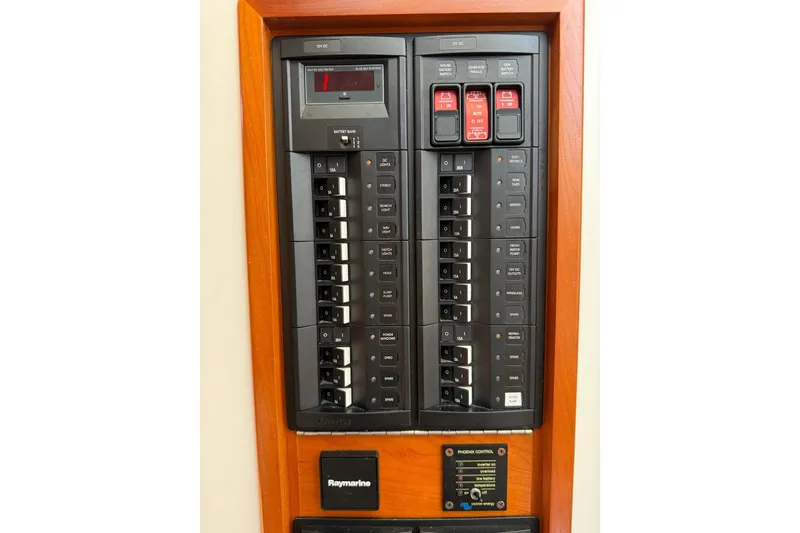 Slide: The Image of Electrical panel on a 2018 MJM 35z boat, featuring switches and controls. - 35