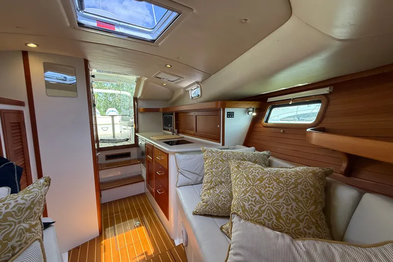 Slide: The Image of Luxurious interior of a 2018 MJM 35z yacht with elegant wood finishes and plush seating. - 28