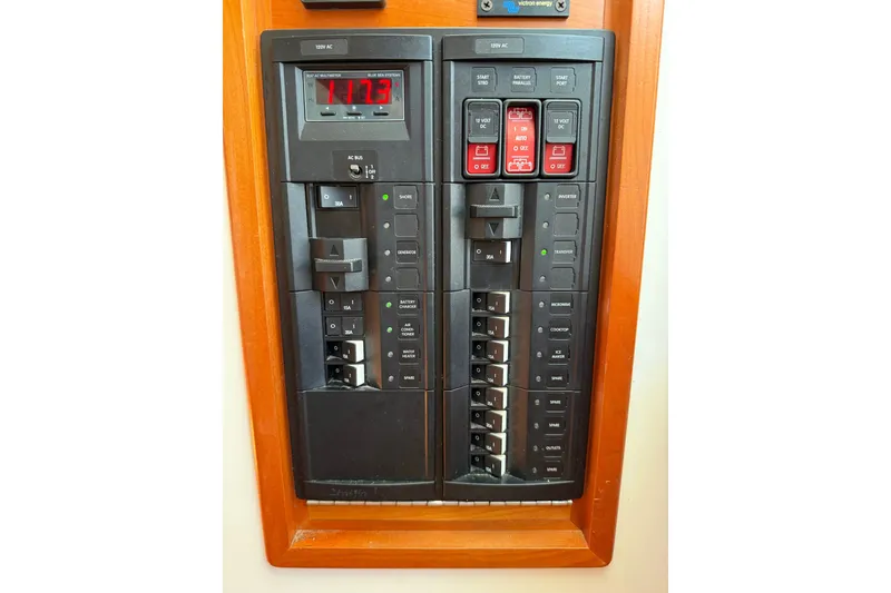 Slide: The Image of Electrical panel on a 2018 MJM 35z boat, featuring switches and voltage display. - 36