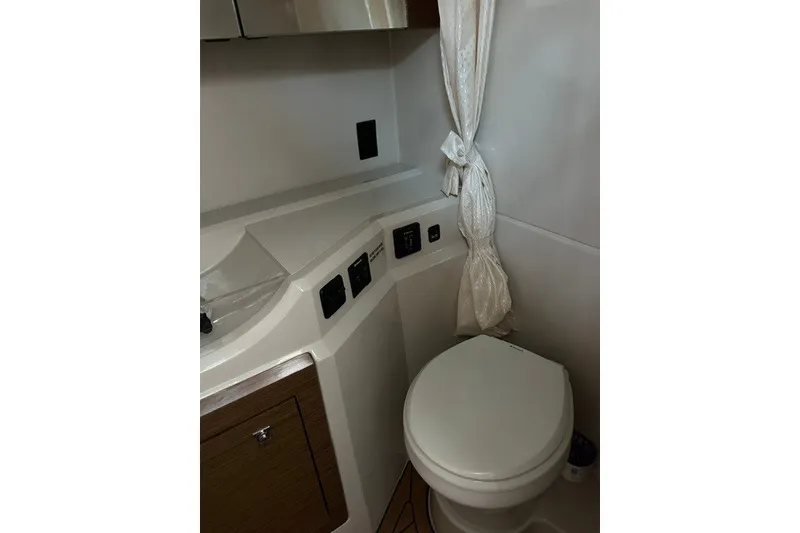 Slide: The Image of Bathroom interior of 2015 Cruisers Sport Series 328 yacht, featuring modern fixtures and cabinetry. - 41
