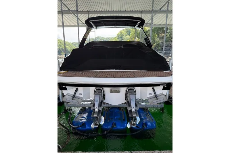 Slide: The Image of 2015 Cruisers Sport Series 328 boat with covered deck, docked in a marina. - 25