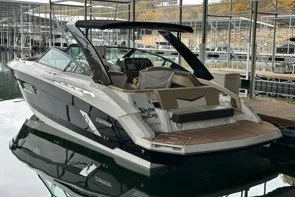 The Image of 2015 Cruisers Sport Series 328 boat docked in a marina, rear view. - 0