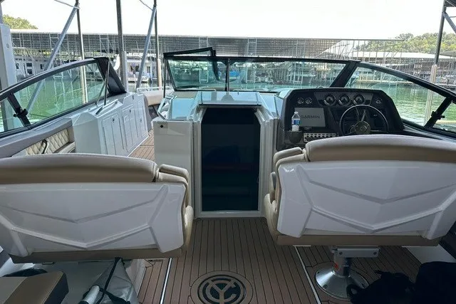 Slide: The Image of 2015 Cruisers Sport Series 328 boat interior with dual seats and modern dashboard. - 36